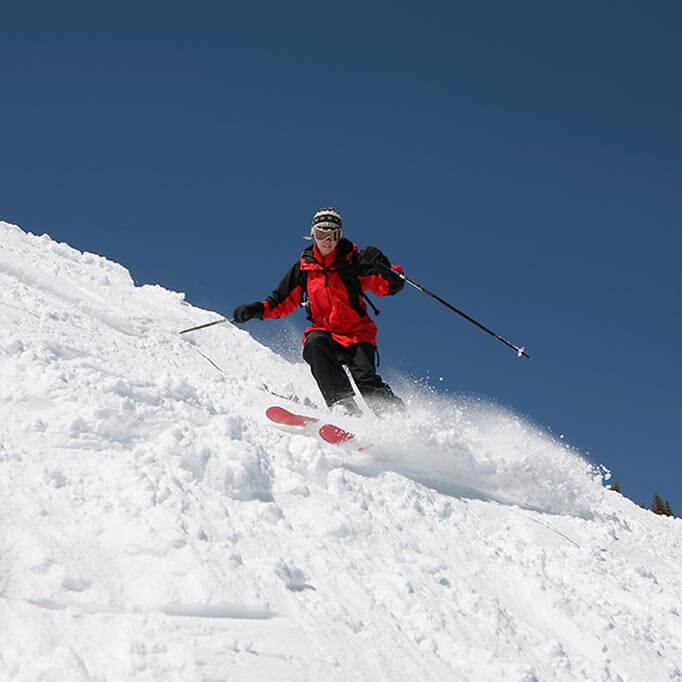 Advanced skier on a steep slope